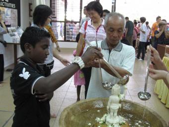 Different races celebrating Wesak together.
